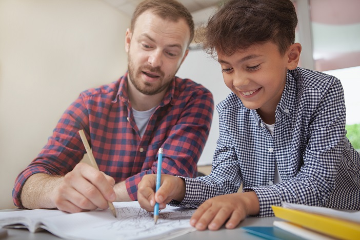 Cropped,Shot,Of,A,Happy,Charming,Schoolboy,Smiling,Joyfully,,Drawing